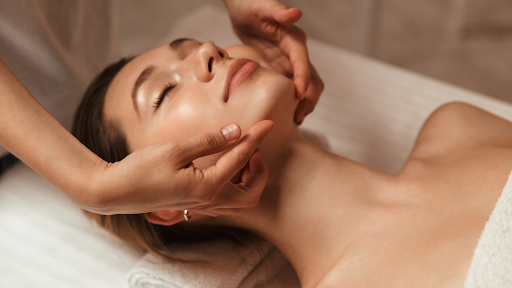 Client relaxing during facial treatment at Park City Medesthetix spa